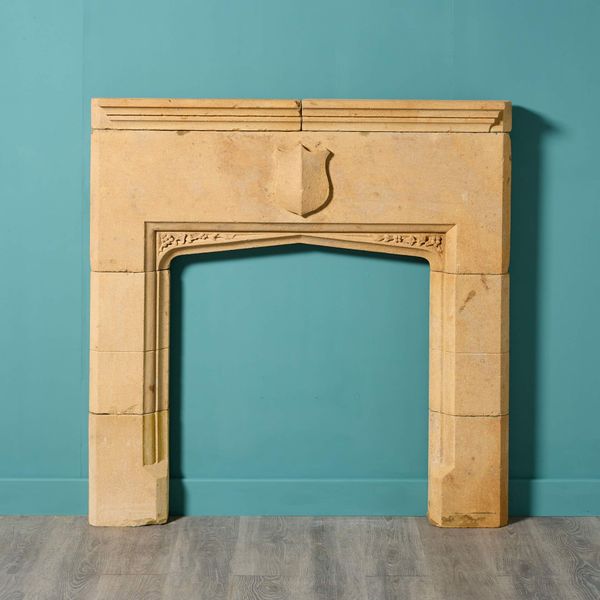 Antique Tudor Style Limestone Fireplace with Shield