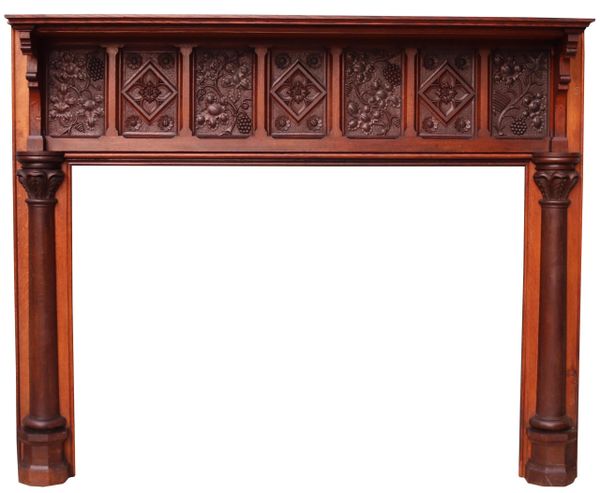 An English Arts and Crafts Style Carved Oak Fireplace