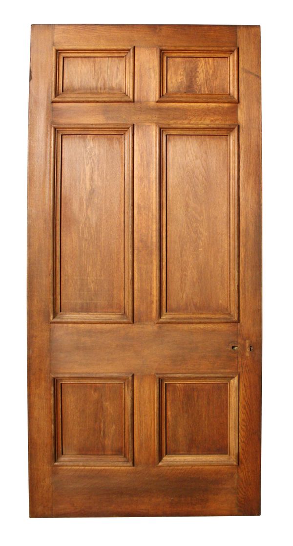 A Large Reclaimed Oak Six Panel Door with Marquetry Panels