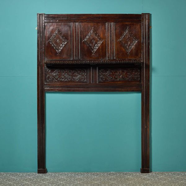 Carved Dark Oak Tudor Fireplace with Overmantel